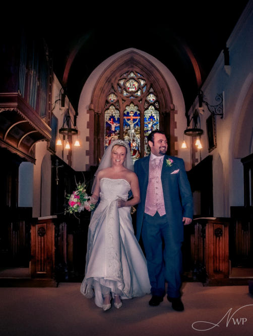 Berkshire photographer creates wedding image of couple by church window, civil ceremony
