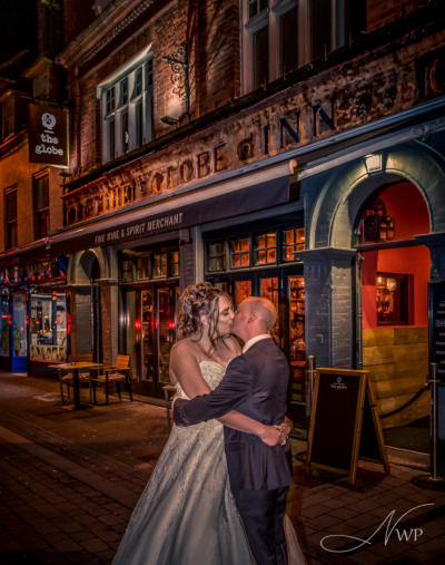 Newbury Wedding Photographer takes dramatic couple photo by Town Centre Globe Pub