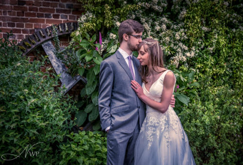 Newbury wedding photography couple by water wheel